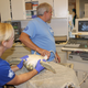 Dr. Pelton and Melissa Ranly performing and ultrasound on a juvenile green sea turtle to look for issues in the digestive tract. Photo Credit : Jackie Shum/ Marine Science Center.